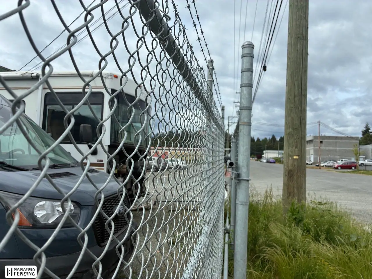Commercial chain link fence with rolling gate