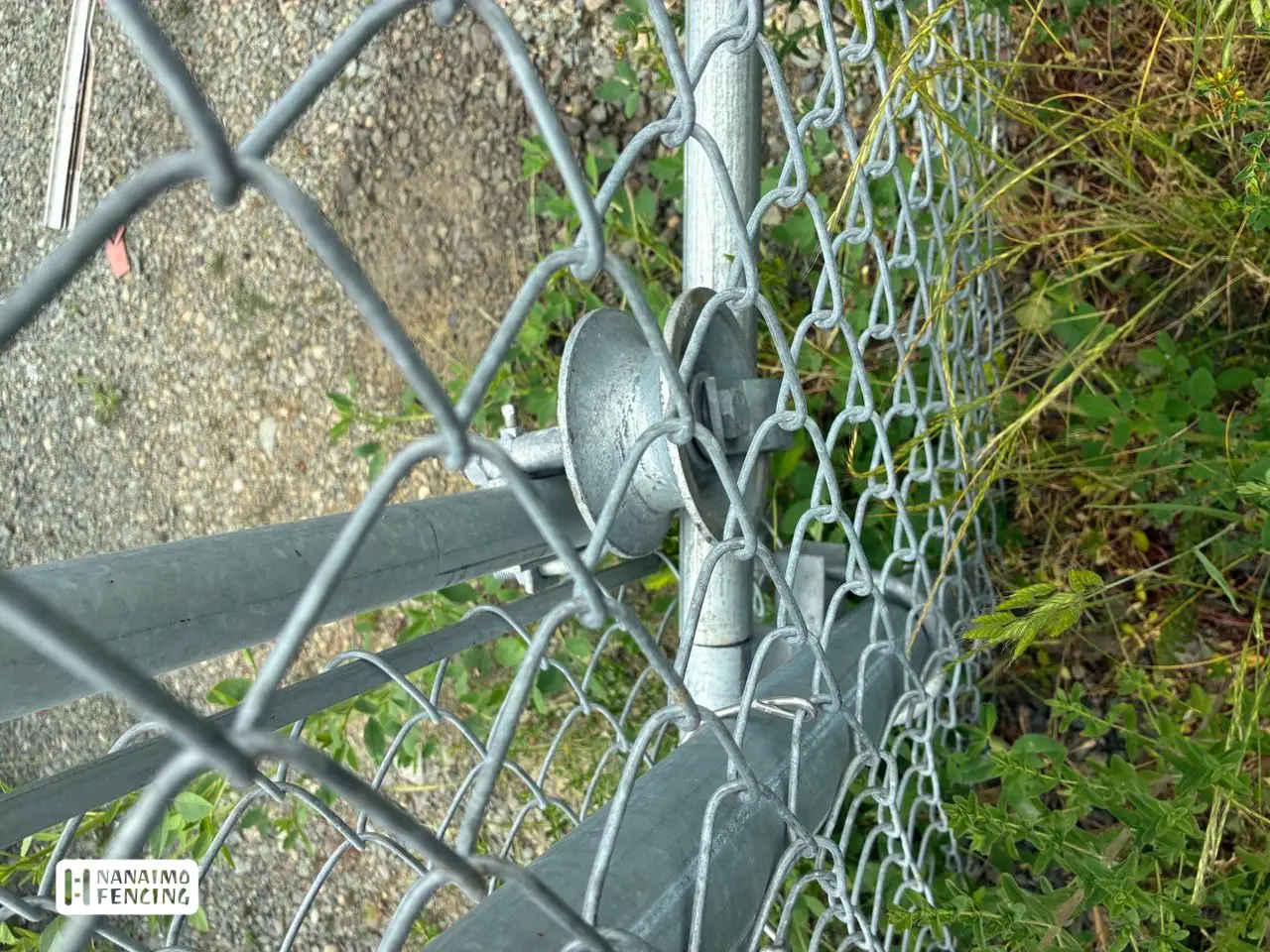 Industrial yard perimeter security fencing with rolling access gate
