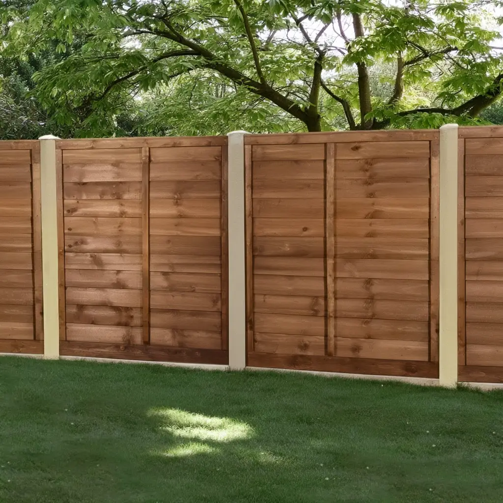 Brown wooden cedar fence panels under blue sky